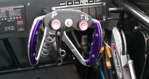 Steering wheel of high-speed drag race car. Cinema 4K 60fps video