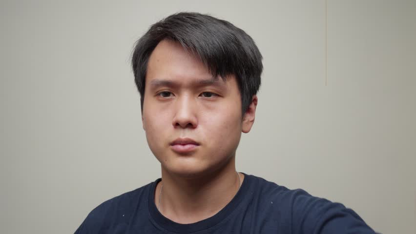 Portrait Of A Chinese Man Wears Cycling Goggles With Rainbow Mirrored Lens. - closeup shot