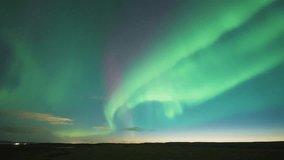 A spectacular dance of Aurora Borealis in the dark winter sky above the sea. A timelapse video. - Powered by Shutterstock - Get 15% off with code: PIKWIZARD15