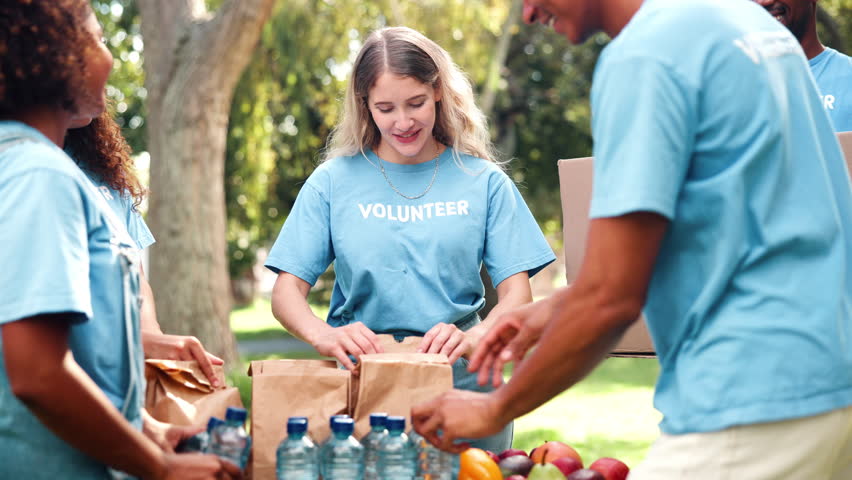 Donation, volunteering or people with teamwork at park with water, collection or community service. NGO, support and student friends celebrating earth day with charity, help or aid for poverty relief - Powered by Shutterstock - Get 15% off with code: PIKWIZARD15