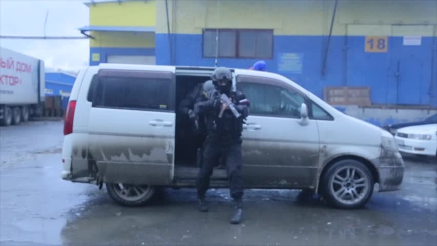 Riot police out of the car. Police enforcement. Armed men ran out of the van | Shutterstock HD Video #34980595