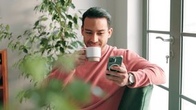 Smartphone, coffee and man relaxing on sofa for social media, mobile app and browsing internet in living room. Phone, smile and male person with warm beverage for happiness, peace and reading text - Powered by Shutterstock - Get 15% off with code: PIKWIZARD15