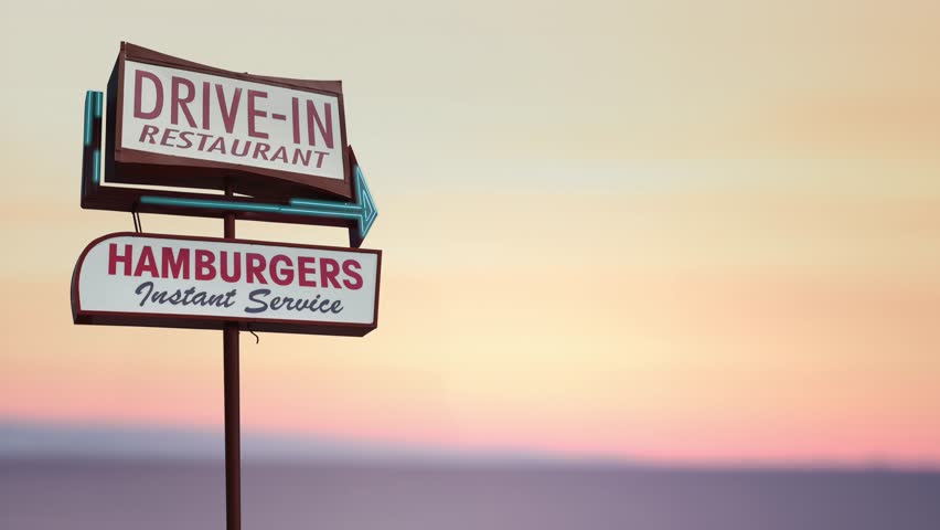 A Flashing Retro Vintage Sign For A Drive-In Diner Or Restaurant In The Californian Desert (Looping)