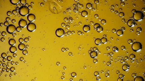 Bubbles. The movement of bubbles in liquid yellow