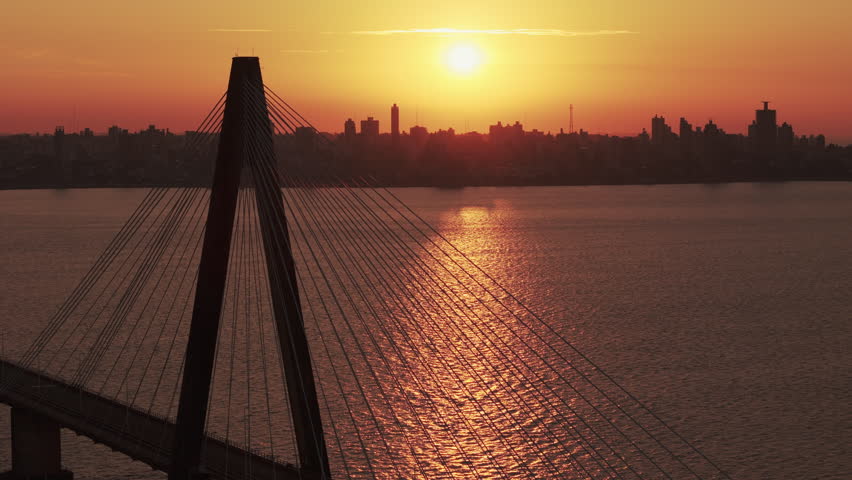 Drone shot very close to the San Roque González de Santa Cruz International Bridge. Clear sunset over the Paraná River.
Flight between the countries of Argentina and Paraguay