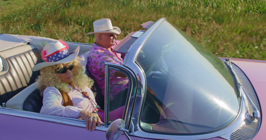 A senior Cowgirl and Cowboy cruising in the sunshine. Royalty-Free Stock Footage #3498170961