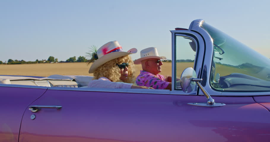 A senior Cowgirl and Cowboy cruising in the sunshine. Royalty-Free Stock Footage #3498173217