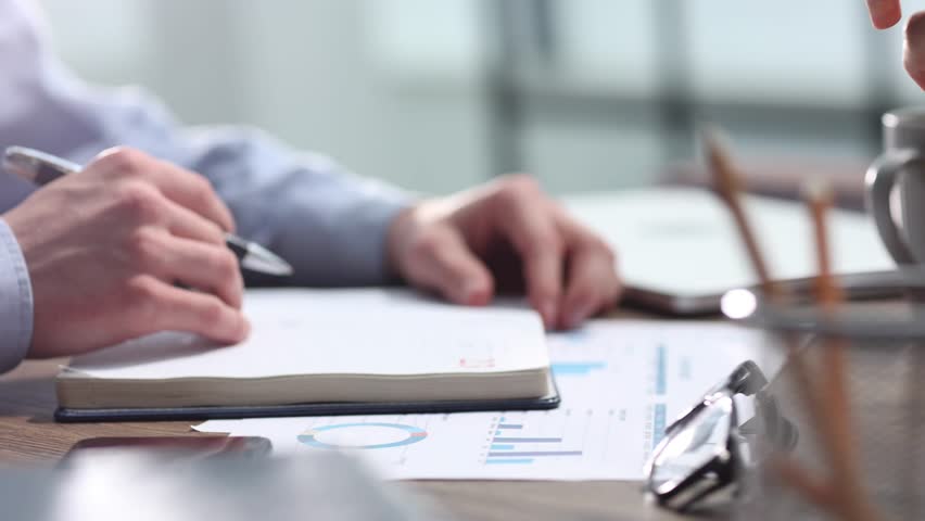 Using the phone checking documents business work