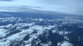 The beauty of the cloudy sky with the forest from above the air at high altitude