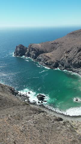 Beatiful beach in Todos Santos, Baja California Sur, right below a cliff. Incredible blue and green water, untouched paradise. 