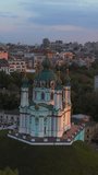 Aerial view of St. Andrew's Church at sunset, Kyiv, Ukraine. Vertical video. 