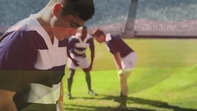 Animation of flag of germany over tired caucasian rugby player and teammates on pitch. German, nationality, team, preparation, sport and competition, digitally generated video. - Powered by Shutterstock - Get 15% off with code: PIKWIZARD15