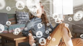 Animation of network of connections with icons over caucasian woman drinking coffee. Global connections, lifestyle and digital interface concept digitally generated video. - Powered by Shutterstock - Get 15% off with code: PIKWIZARD15