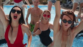 Noisy summer party in swimming pool in country luxury club. Friends in bikinis having fun, listening to music, singing, drinking cocktails, dancing and enjoying hot vacation together in water. - Powered by Shutterstock - Get 15% off with code: PIKWIZARD15