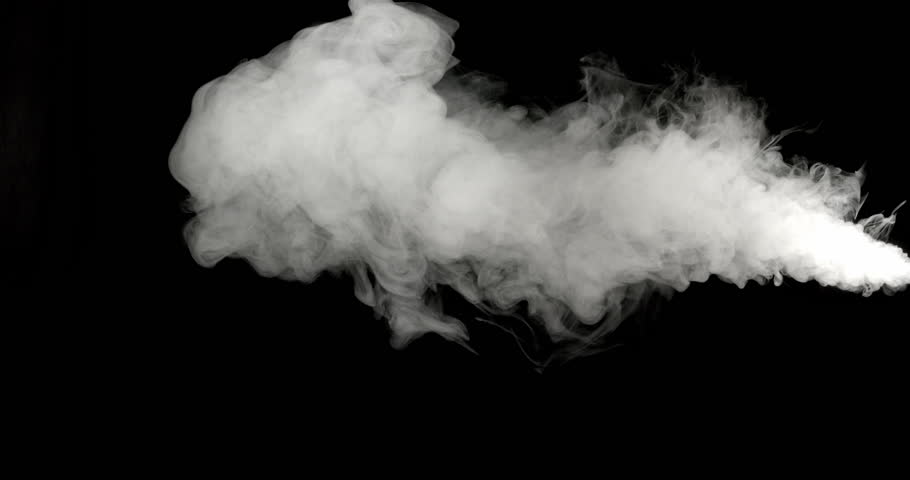 Plumes of thick smoke float across a black background. The lighting accentuates its swirling form and movement as it spreads in the air