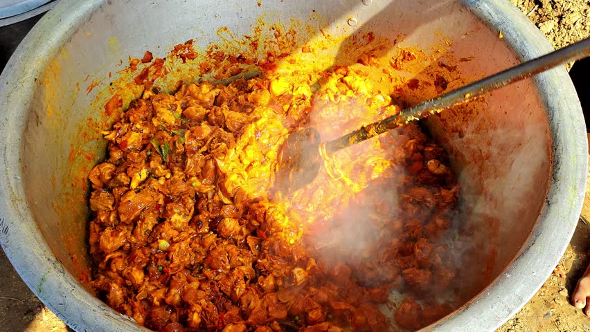 cooking chicken in big pot for public