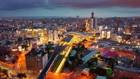 Aerial hyperlapse footage of Taichung, a vibrant metropolis in central Taiwan, with railway tracks extending from the new train station, busy traffic on the streets and city lights dazzling at night - Powered by Shutterstock - Get 15% off with code: PIKWIZARD15