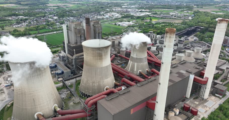 Weisweiler power station, This power plant is mainly fueled by lignite extracted from the Inden open pit mine. Water vapor clouds, detailed view of cooling towers. Aerial drone view. germany.