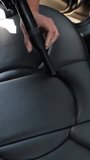 wash worker washes a car, vacuums the interior of the car. Dry cleaning and car detailing. Washing vacuum cleaner. Car interior care. - Powered by Shutterstock - Get 15% off with code: PIKWIZARD15