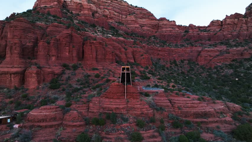 Chapel of the Holy Cross Into The Red Rock Buttes of Sedona, Arizona, USA. Aerial Pullback Shot