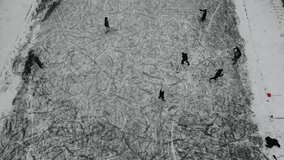 Top aerial view of frozen river channel in Munich with people playing ice hockey and skating  - Powered by Shutterstock - Get 15% off with code: PIKWIZARD15