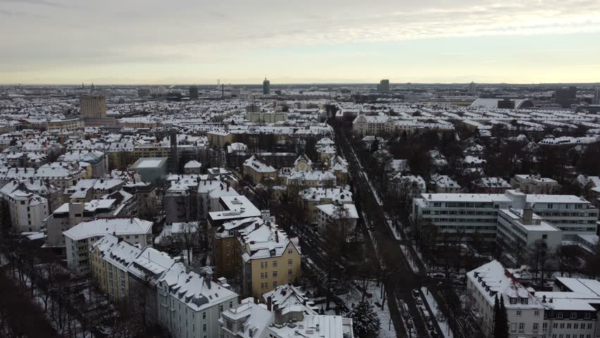 Snow covered winter aerial view of Munich near Nymphenburg with frozen river