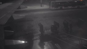 The airport staff loads the luggage onto the plane. A passenger plane is waiting for the cargo to be loaded. High quality 4k footage - Powered by Shutterstock - Get 15% off with code: PIKWIZARD15