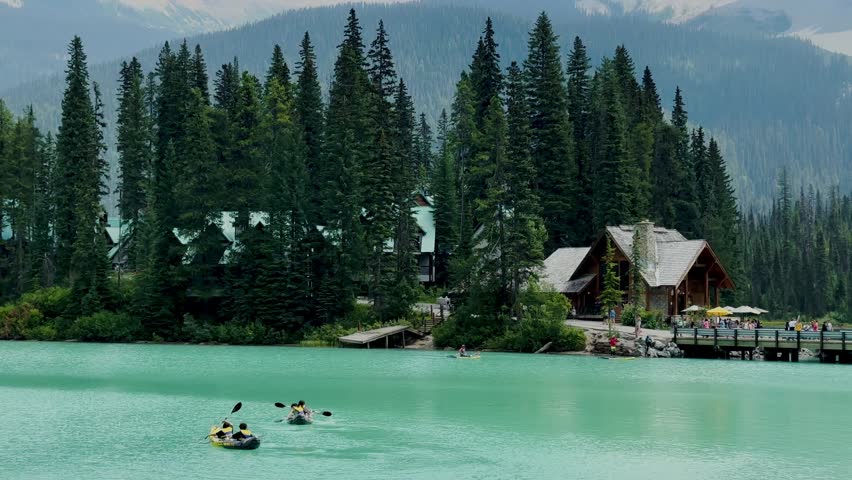 Emerald Lake is located in Yoho National Park in Canada. Famous for its emerald color and the splendid view of the Canadian Rockies that frame it. Canoe excursion with family. Trekking to the lake.
