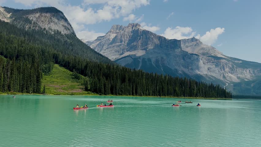 Emerald Lake is located in Yoho National Park in Canada. Famous for its emerald color and the splendid view of the Canadian Rockies that frame it. Canoe excursion with family. Trekking to the lake.
