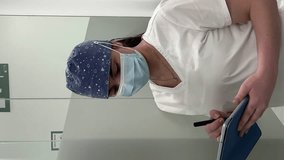 Nurse using a tablet.Vertical video