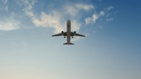 Airplane flies in sky at sunset day. Travel. Airplane takes off against the background of sunset. Ultra HD 4K. - Powered by Shutterstock - Get 15% off with code: PIKWIZARD15
