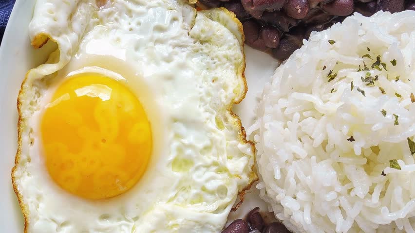 Beans with rice and egg. Typical food from the Caribbean, many parts of Latin America and Sephardic communities.