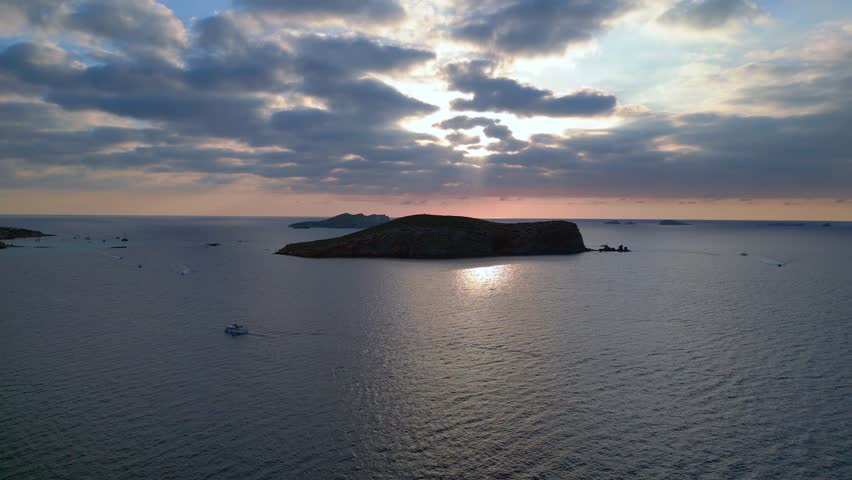 cloudy sunset seascape with island silhouette. Nice aerial top view flight panorama overview drone
4k