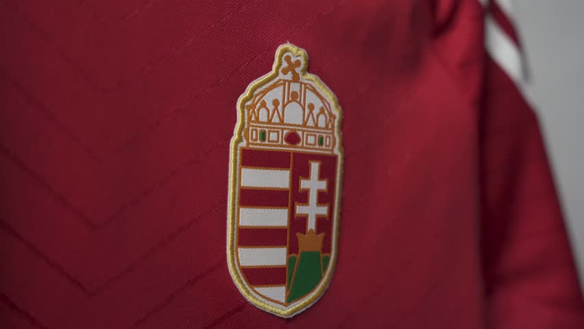 National coat of arms of Hungary on the red short sleeve shirt. European country. Close Up. Selective focus. Football European Championship 2024