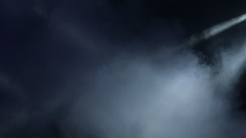 Strobe lights moving and smoke in a stage in a concert