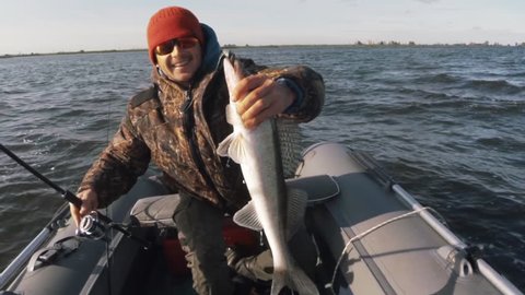Amateur angler catches Zander fish