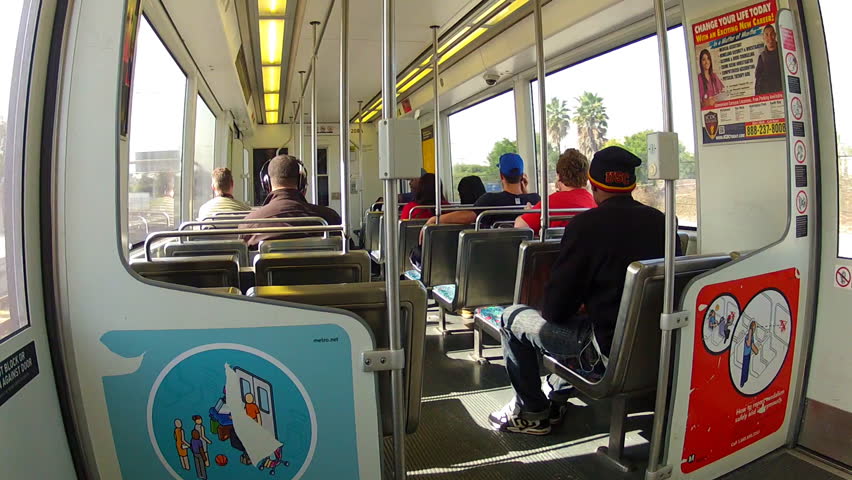 LOS ANGELES, CA - FEBRUARY 23, 2013: People ride the Metro Rail train near LAX