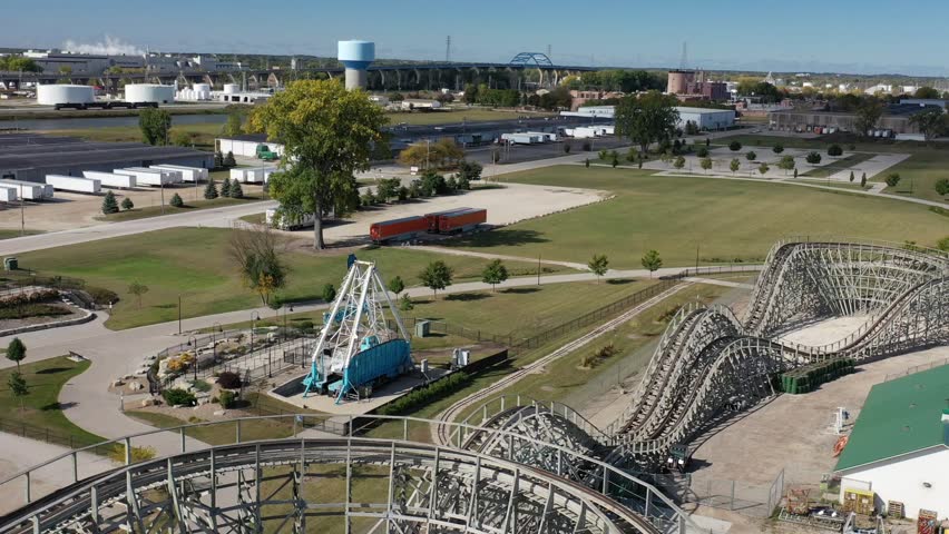Aerial view of Green Bay Wisconsin Bay Beach Amusement Park Zippin Pippin Roller Coaster with bridge and city in the distance