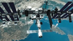 Highly detailed photo-realistic VFX shot of the International Space Station in low Earth orbit, looking down on the Earth from above the ISS, with the planet rotating below as the camera eases back - Powered by Shutterstock - Get 15% off with code: PIKWIZARD15
