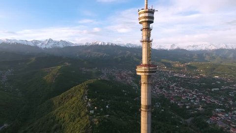 Almaty - MAY 2017: Aerial view shot of the Koktobe TV tower and mountains on background
