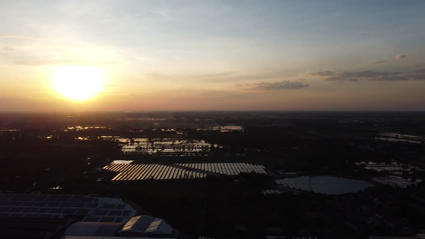 Footage 4K over the Chemical plant cooling tower smoke equipment.  Drone fly over the industrial roofs and cooling tower equipment with  smoke exhaust in chemical plants.