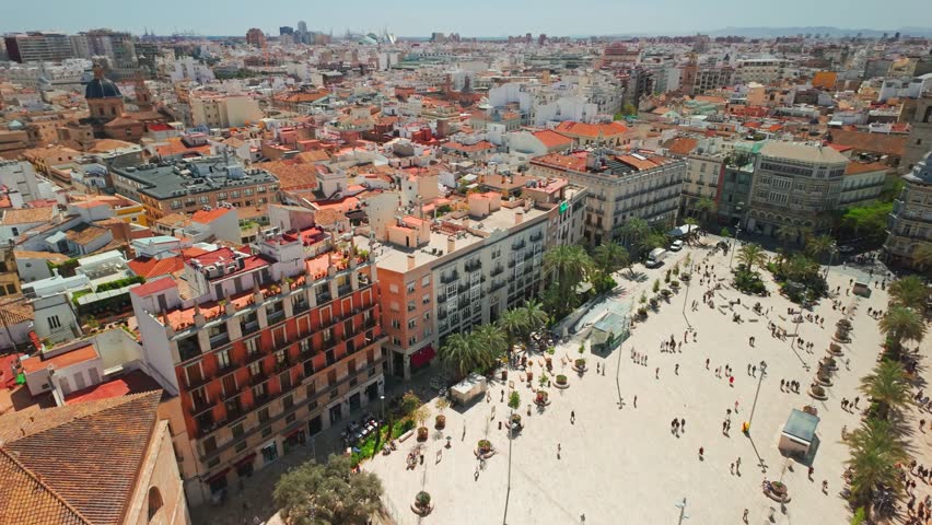 Top view of Plaza de la Reina square in central part of Valencia city, Spain. Slow panning footage of the Valencia cityscape seen from the Bell tower of Valencia Cathedral at sunny day