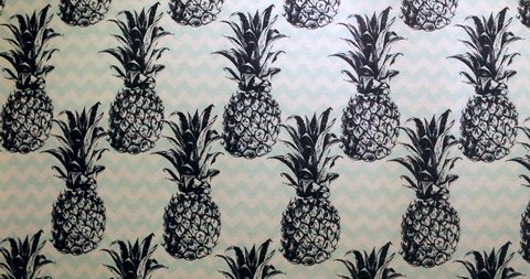 Pineapples stamped on wallpaper