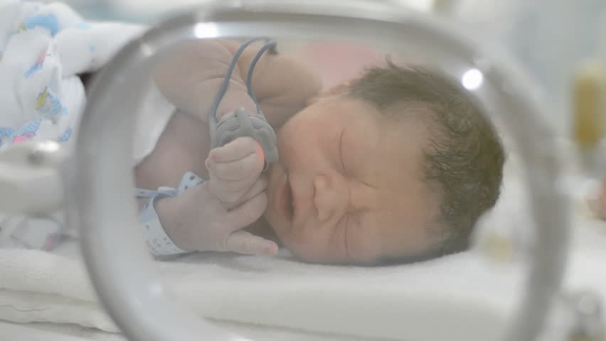 Newborn 20 minutes old in child hood,labour room in hospital | Shutterstock HD Video #35008216