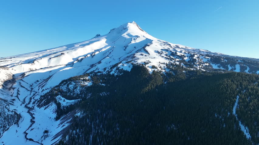 Early morning light illuminates Mount Hood, Oregon. Part of the Cascade Mountain Range, this scenic stratovolcano, usually covered with snow, is not far from the city of Portland.