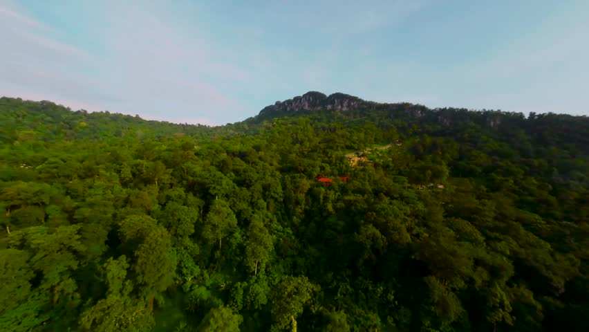 An aerial FPV view peak of rocky hills Bukit tabur during morning. Royalty-Free Stock Footage #3500895327
