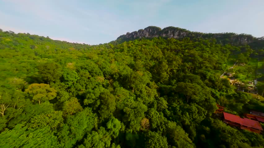 An aerial FPV view peak of rocky hills Bukit tabur during morning. Royalty-Free Stock Footage #3500895863