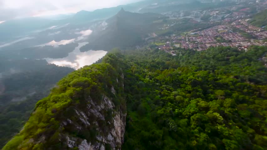 An aerial FPV view peak of rocky hills Bukit tabur during morning. Royalty-Free Stock Footage #3500896067
