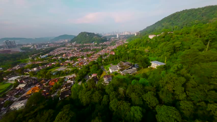 An aerial FPV view peak of rocky hills Bukit tabur during morning. Royalty-Free Stock Footage #3500896337