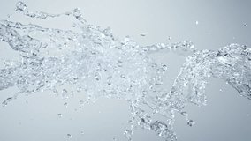 Super Slow Motion Shot of Pure Water Splashes Flying Towards on Gradient Background at 1000fps. - Powered by Shutterstock - Get 15% off with code: PIKWIZARD15